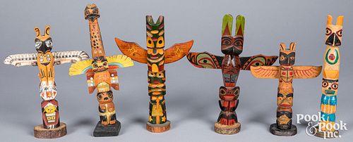 Six  Northwest Coast Indian carved totem poles