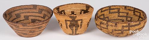 Three Southwestern coiled baskets, one having huma