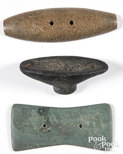 Three drilled stone objects