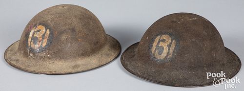 Two US WWI doughboy 131st Infantry helmets