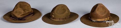 Two US WWI campaign hats, one with purple piping