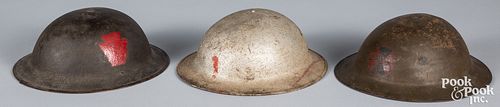 Three US WWI doughboy helmets