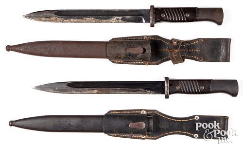 Two WWII German K98 bayonets, scabbards and frogs