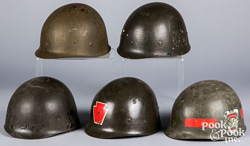 Five American helmet liners