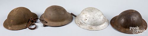 Four US WWI doughboy helmets