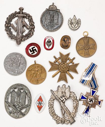 Fourteen German WWII tinnies, badges, and medals