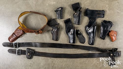 Group tooled leather holsters and belts