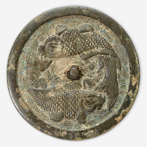 A Chinese bronze "Twin Carp" circular mirror Jin Dynasty (1115-1234)