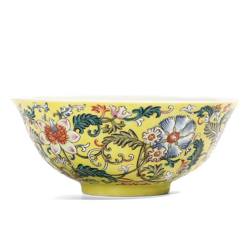A CHINESE YELLOW-GROUND FAMILLE-ROSE ‘FLORAL' BOWL