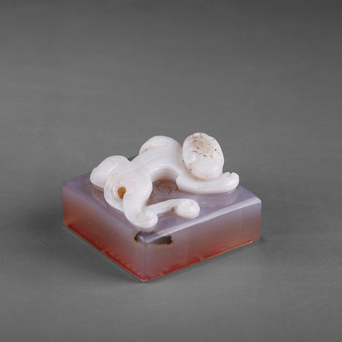 A CHINESE AGATE ARCHAISTIC 'CHILONG' SEAL 