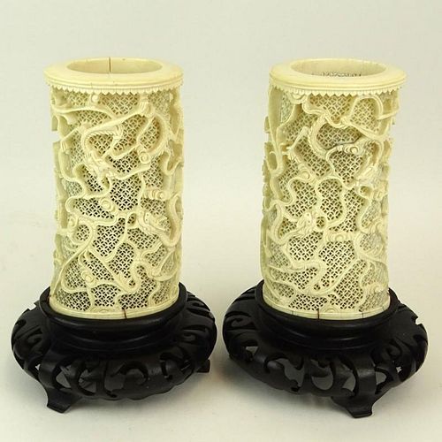 Pair of Chinese Intricately Carved Reticulated Ivory Vases Mounted as Lamps on Carved Wood Bases.