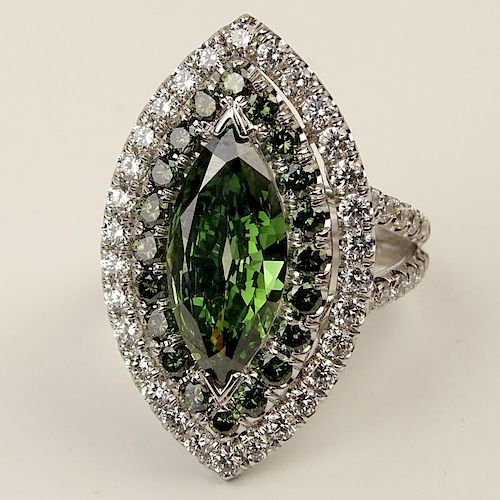 Lady's Large Marquise Cut Enhanced Green Diamond, Round Cut Green and White Diamond and 18 Karat White Gold Ring