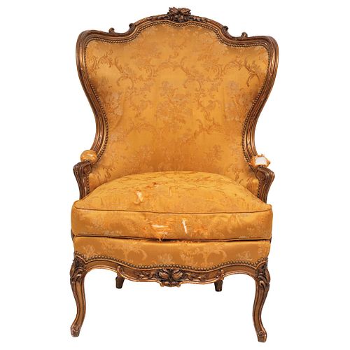 BERGERE ARMCHAIR FRANCE, 19TH CENTURY LOUIS XV STYLE Carved in wood with golden upholstery Includes original lining 55.1 x 32.6 x 24" (140 x 83 x 61 c