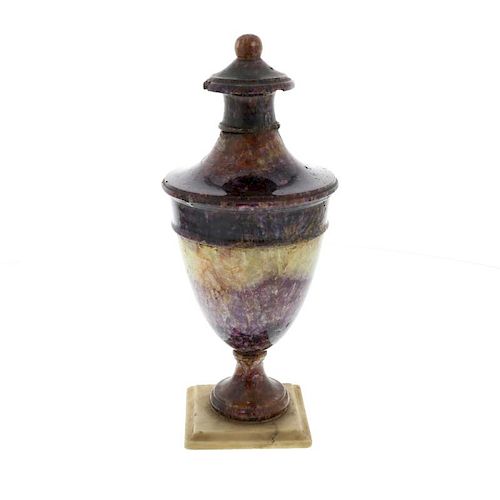 A 19th century Blue John urnBlue John Cavern vein group Of neoclassical ovoid form with ball finial