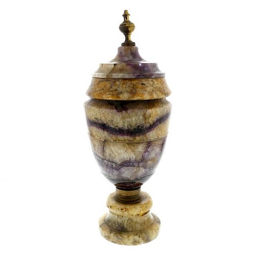 A large Derbyshire fluorspar urn Of neoclassical ovoid form with turned brass finial over fixed 'cov