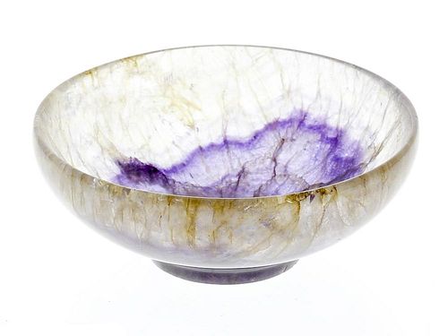 A Blue John bowl The shallow hemispherical body with central leaf-shaped lilac marking, within clear