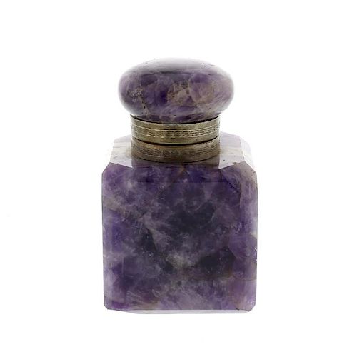 An amethyst ink bottle The hinged cover with flattened bun finial over engraved rim, the canted cubo
