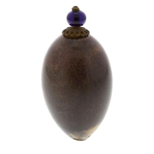 A hardstone scent bottle. The ovoid body with brown and beige hue, glowing violet under light, 48mm