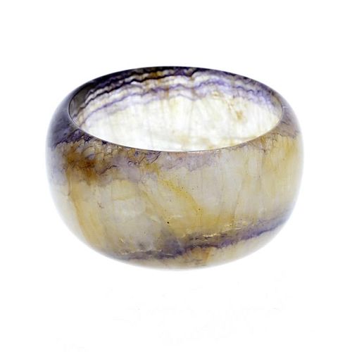 A Blue John bowl. Of hemispherical form with parallel rim banding and a further purple ring to base,