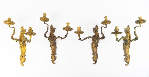 A Set of Four Louis XV Style Gilt-Bronze Sconces
Height 14 x width 10 x depth 7 1/2 inches.