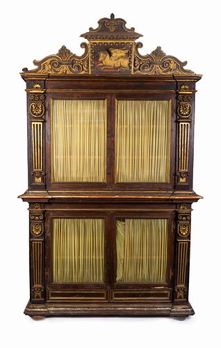 An Italian Neoclassical Parcel-Gilt and Carved Walnut Bookcase
Height 107 1/2 x width 63 x depth 17 inches.