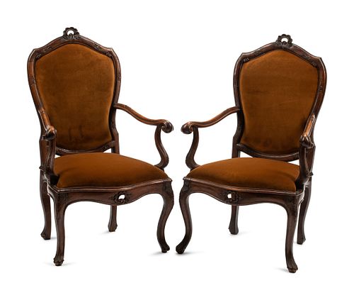 A Pair of Venetian Carved Walnut Armchairs
Height 42 x width 26 x depth 23 inches.