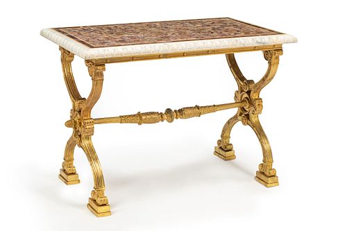 A Baltic Style Gilt Bronze Table with an Amethyst and Marble Top
Height 30 1/2 x width 41 1/2 x depth 25 inches.