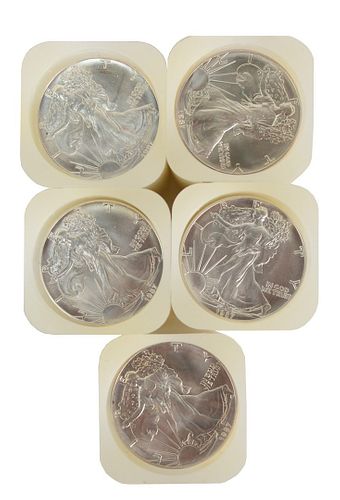 Five Rolls of Liberty Silver Eagles, one hundred 1987 coins total.
