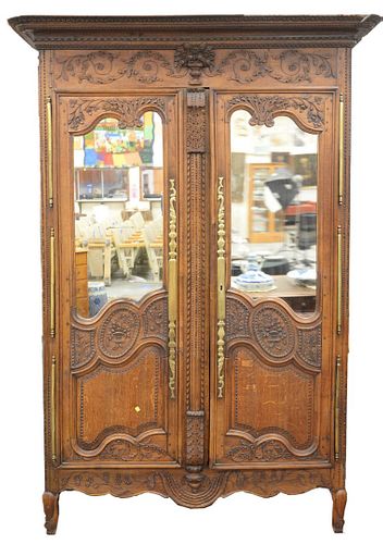 Louis XV Oak Armoire, top with 3D carved basket of flowers under molding and two carved panels and glass doors, 18th century, height 95 inches with re