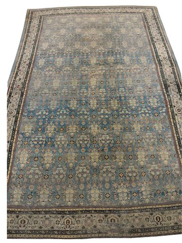 Agra Oriental Carpet, having pale blue field, 13' 5" x 22', [one end border is very worn with hole, rug cut and reduced on one end].