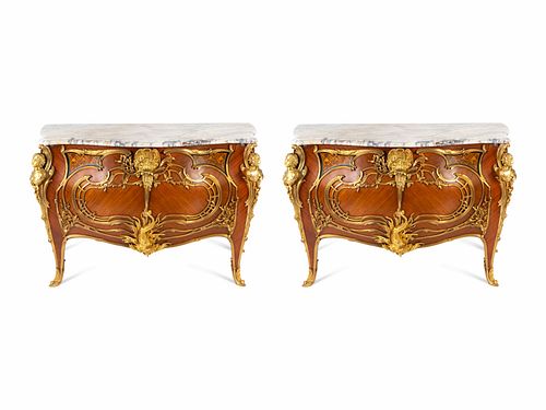 A Pair of Louis XV Style Gilt Bronze Mounted Marble-Top Commodes
Height 38 x width 55 x depth 25 inches.