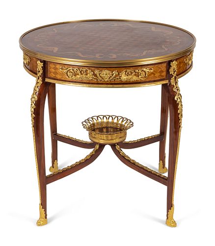 A Louis XV Style Gilt Bronze Mounted Marquetry Table
Height 30 x width 29 1/2 inches.