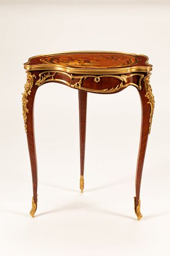 A Louis XV Style Marquetry Cartouche Table
Height 29 x width 22 1/2 x depth 14 1/2 inches.
