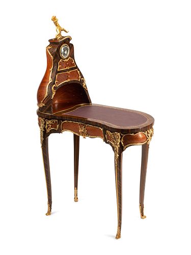 A Louis XV Style Gilt Metal Mounted Cartonnier Desk
Height 57 x width 34 x depth 18 1/2 inches.