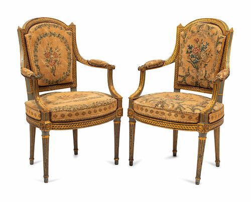 A Pair of French Neoclassical Painted and Parcel Gilt Armchairs
Height 37 1/2 x width 23 1/2 x depth 20 inches.
