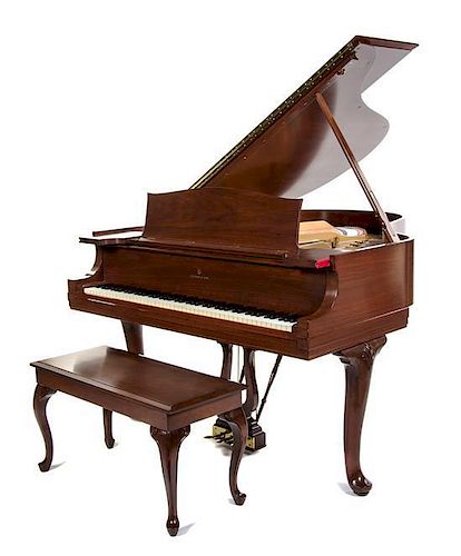 A Steinway & Sons Baby Grand Piano Height 38 x width 56 x depth 66 inches.
