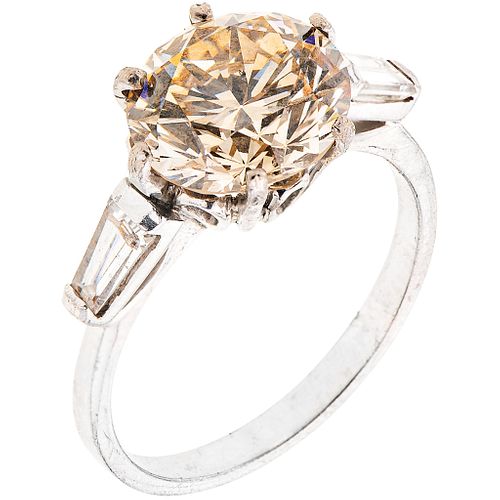 RING WITH DIAMONDS IN PALLADIUM SILVER 1 brilliant cut diamond ~3.23 ct Clarity: VS2 and 2 Baguette cut diamonds. Size: 6 ¾
