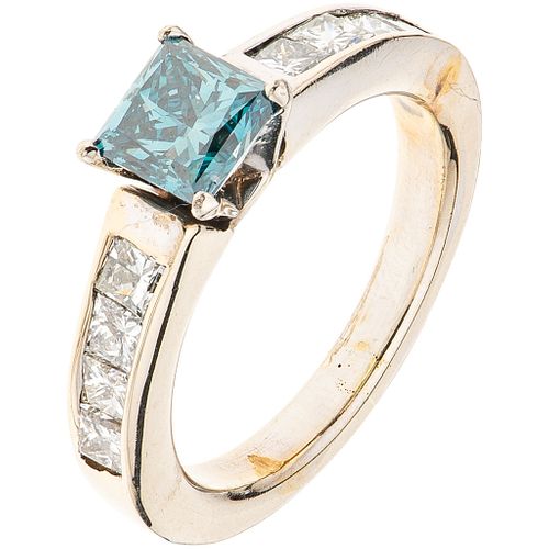RING WITH DIAMONDS IN 14K WHITE GOLD 1 blue princess cut diamond ~0.75 ct Clarity: I2-I3 and 8 princess cut diamonds