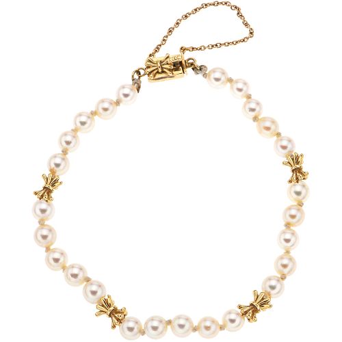 BRACELET WITH CULTURED PEARLS IN 14K YELLOW GOLD with 25 cream colored pearls. Weight: 8.6 g. Length: 7" (18.0 cm)
