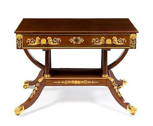 An Empire Gilt Bronze Mounted Mahogany Writing Table Height 28 1/4 x width 41 3/4 x depth 25 1/8 inches.