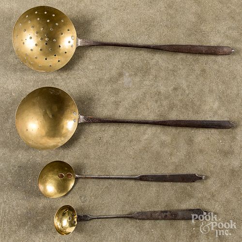 Four wrought iron and brass ladles, 19th c.