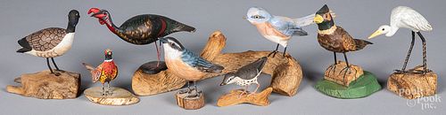 Eight carved and painted birds