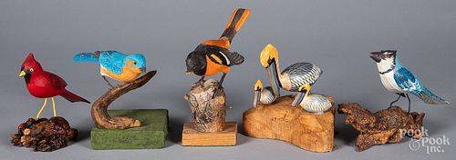Five carved and painted birds