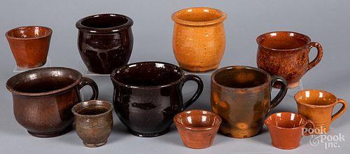 Redware mugs and small crocks, 19th c.