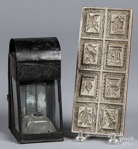 Tin lantern, together with a lead food mold