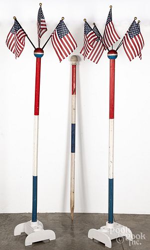 Three American flag display poles, stands only