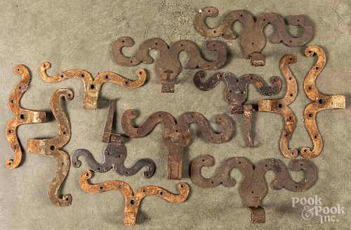 Collection of antique wrought rams horn hinges