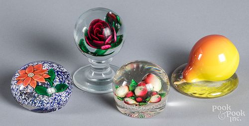 Four glass paperweights