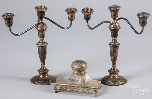 A pair of weighted sterling silver candelabra