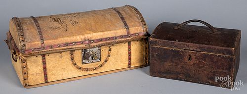 Two hide and leather covered dome lid trunks